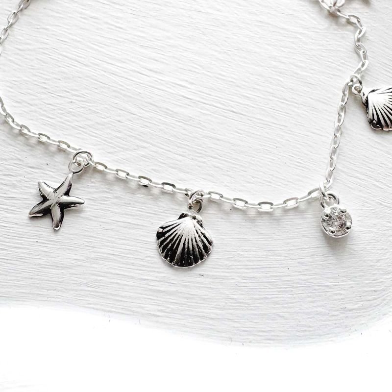 Pulseira de Prata Pingente Estrela e Concha Penduradas